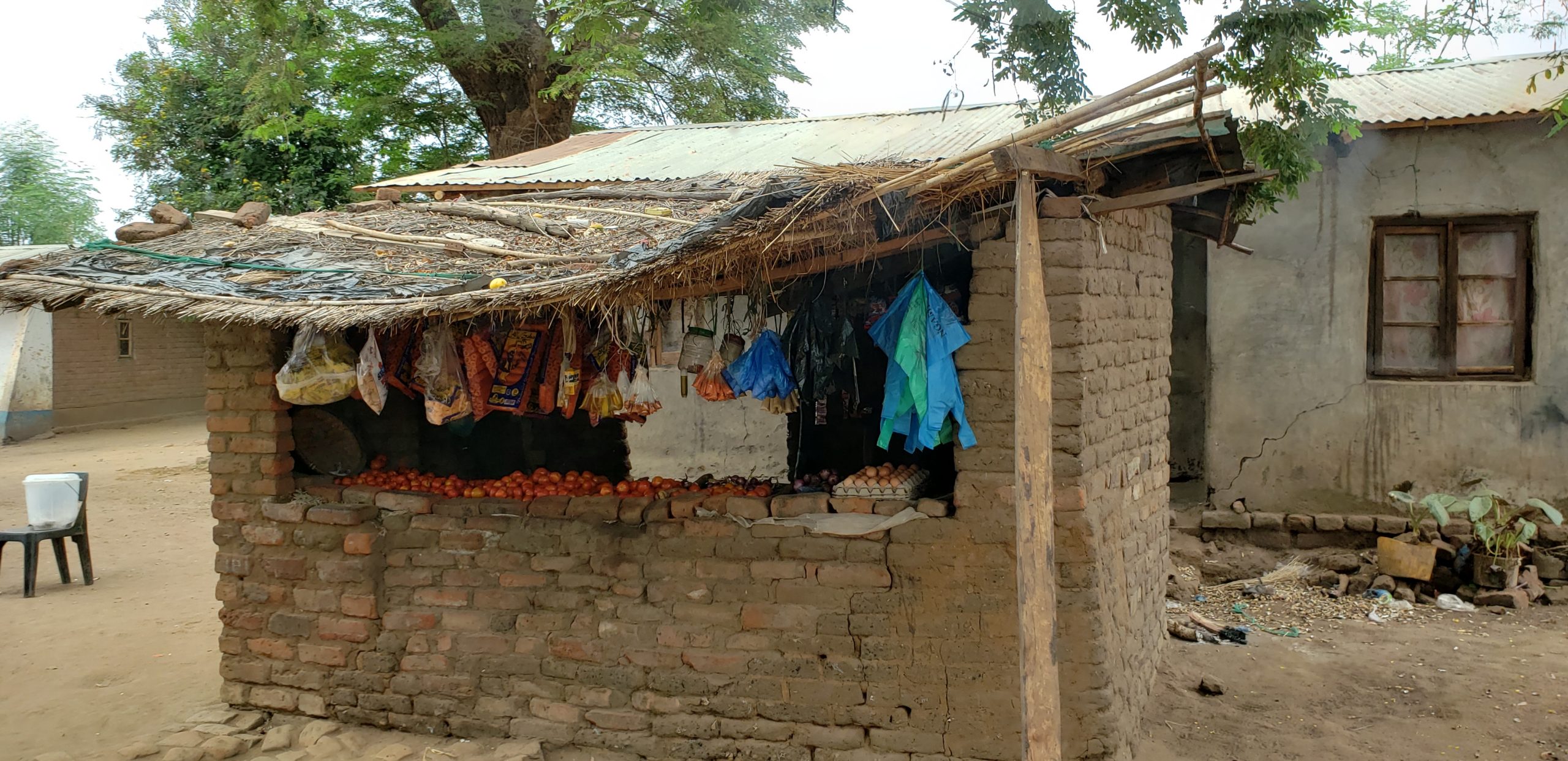 Local store with available food for purchase. Notice it is only tomatoes and Mangos along with highly processed food that has been repackaged.